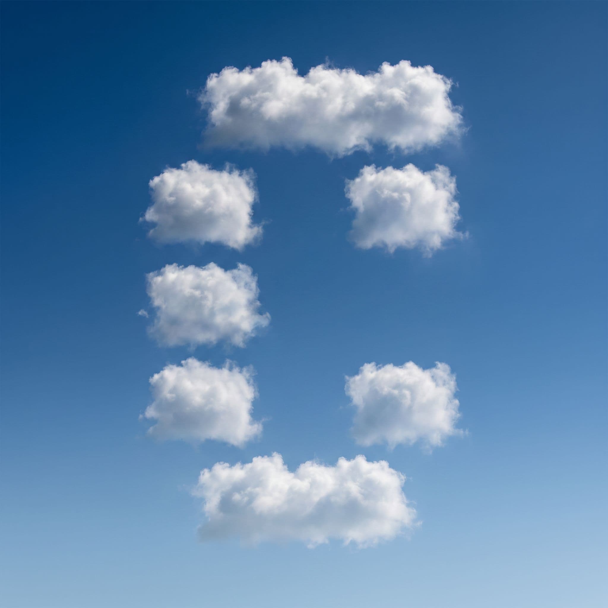 Clouds arranged in the shape of the Conductor logo against a blue sky